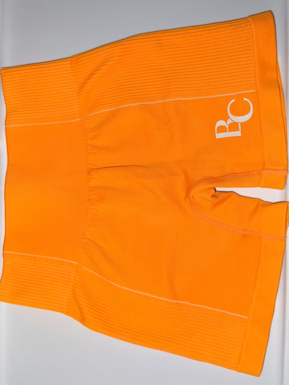 Seamless Orange Women’s Ribbed Workout Shorts with Logo